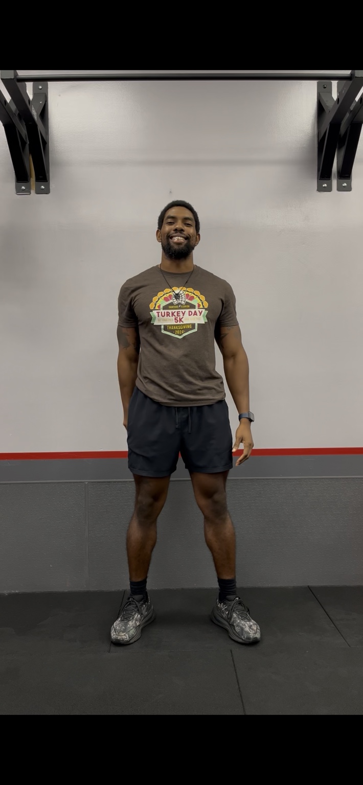 Coach Kevin smiling in a training studio